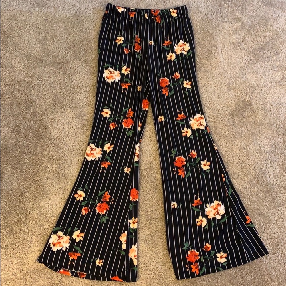 Black and floral prints flair pants.